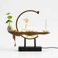 Ceramic Deer Sculpture on Warm LED Crescent Table Lamp